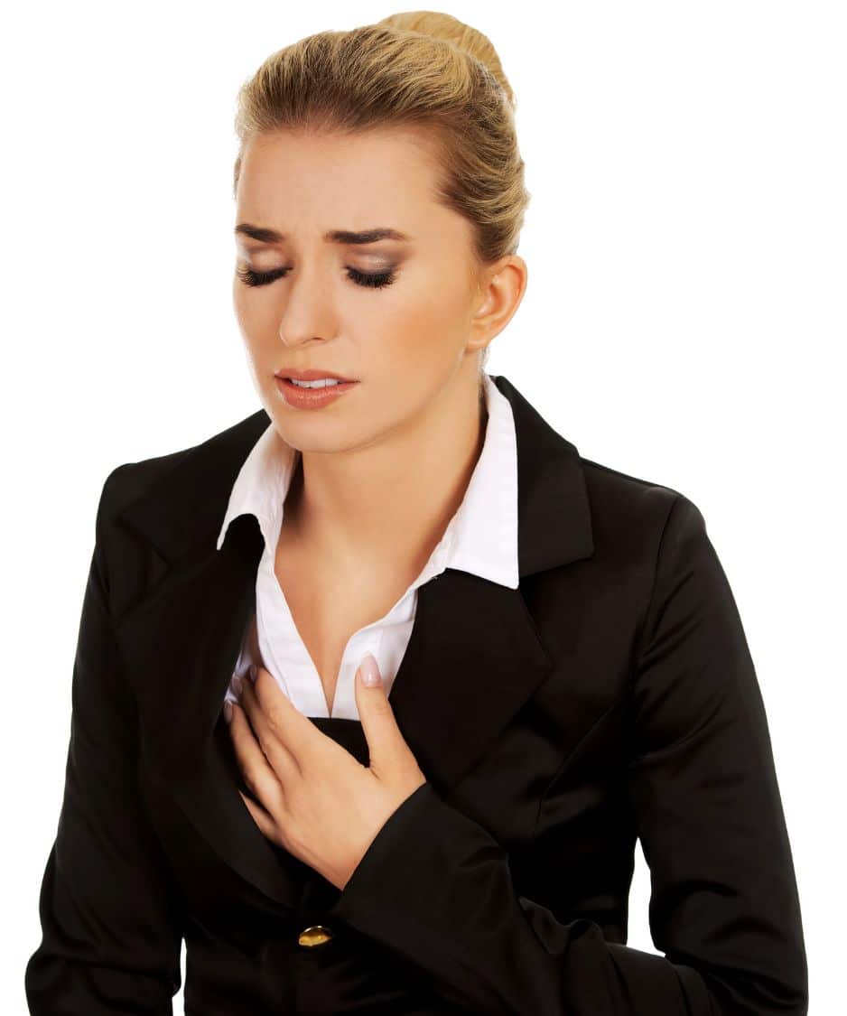 woman holding her chest in pain