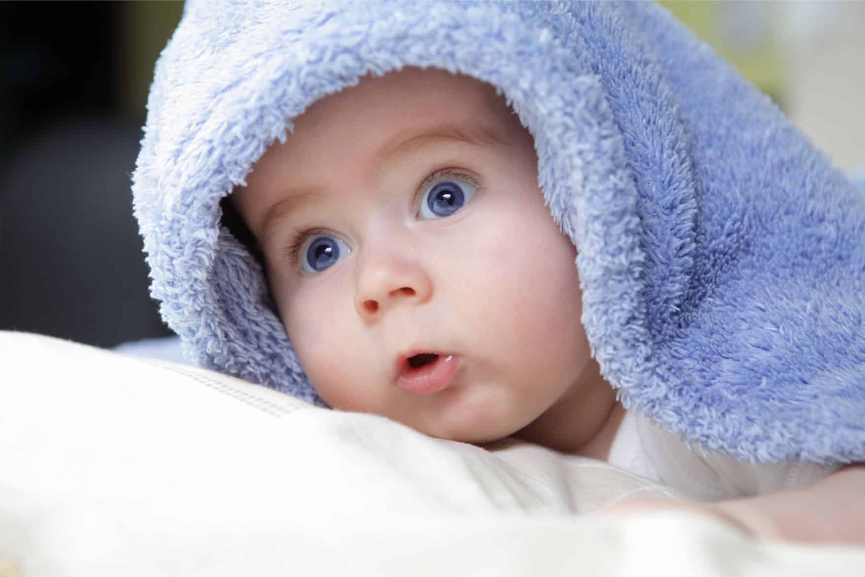 image of a newborn baby with a blanket on them